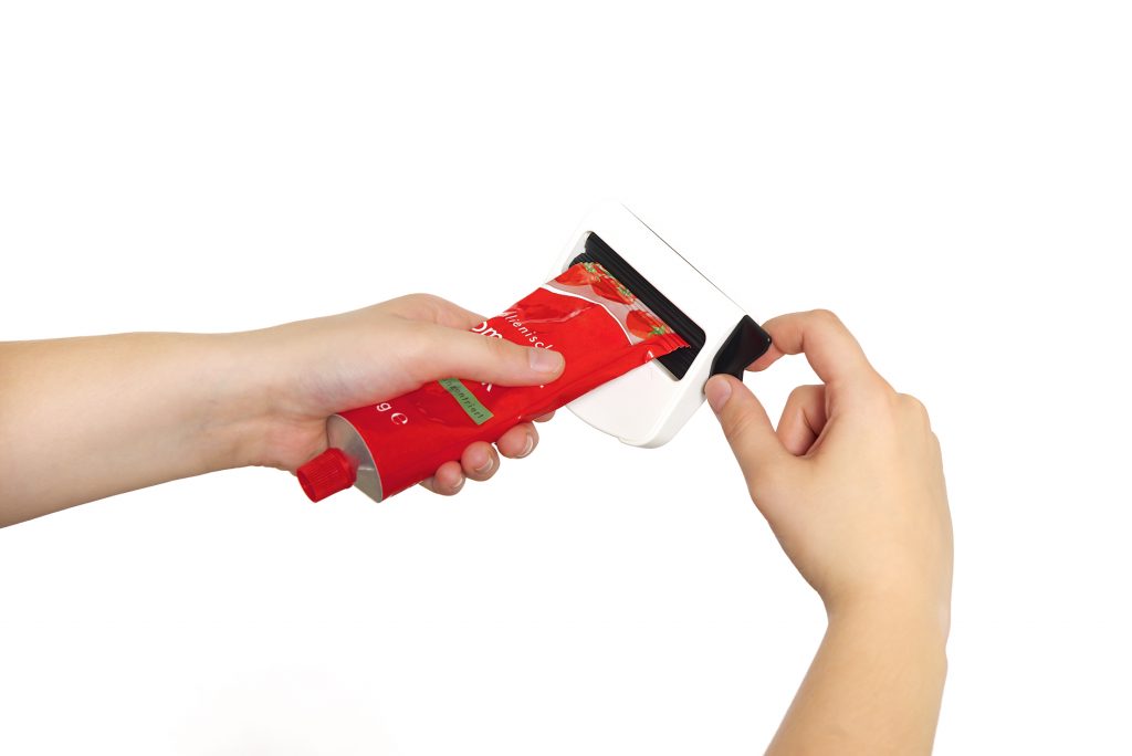 Alu Tube eingepannt in Tubfix Tubenpresse